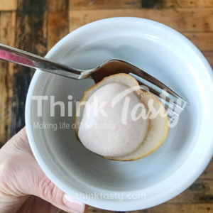 Cranberry juice poached pears topped with cinnamon sweetened yogurt- a healthy dessert that eats indulgently