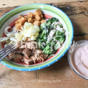 All sorts of flavors and textures in this bowl filled with season tofu, caramelized onions, roasted sweet potato and broccoli and topped with pineapple