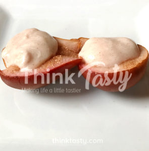 Cranberry juice poached pears topped with cinnamon sweetened yogurt- a healthy dessert that eats indulgently