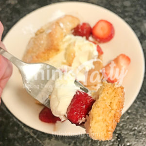 Homemade shortcake topped with macerated strawberries and mascarpone whipped cream