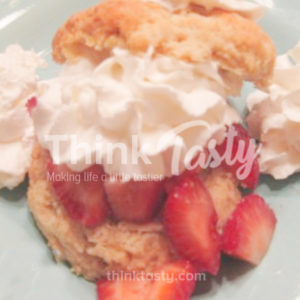 Strawberry shortcake topped with whipped cream