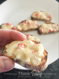 Crostini topped with hot pimento cheese