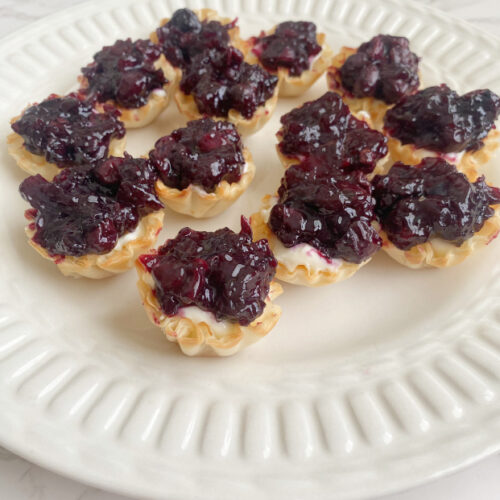 Handheld Tarts Bursting with Blueberries | Think Tasty